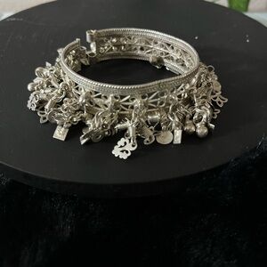 Intricate Silver Charm Bracelet with Vintage Style